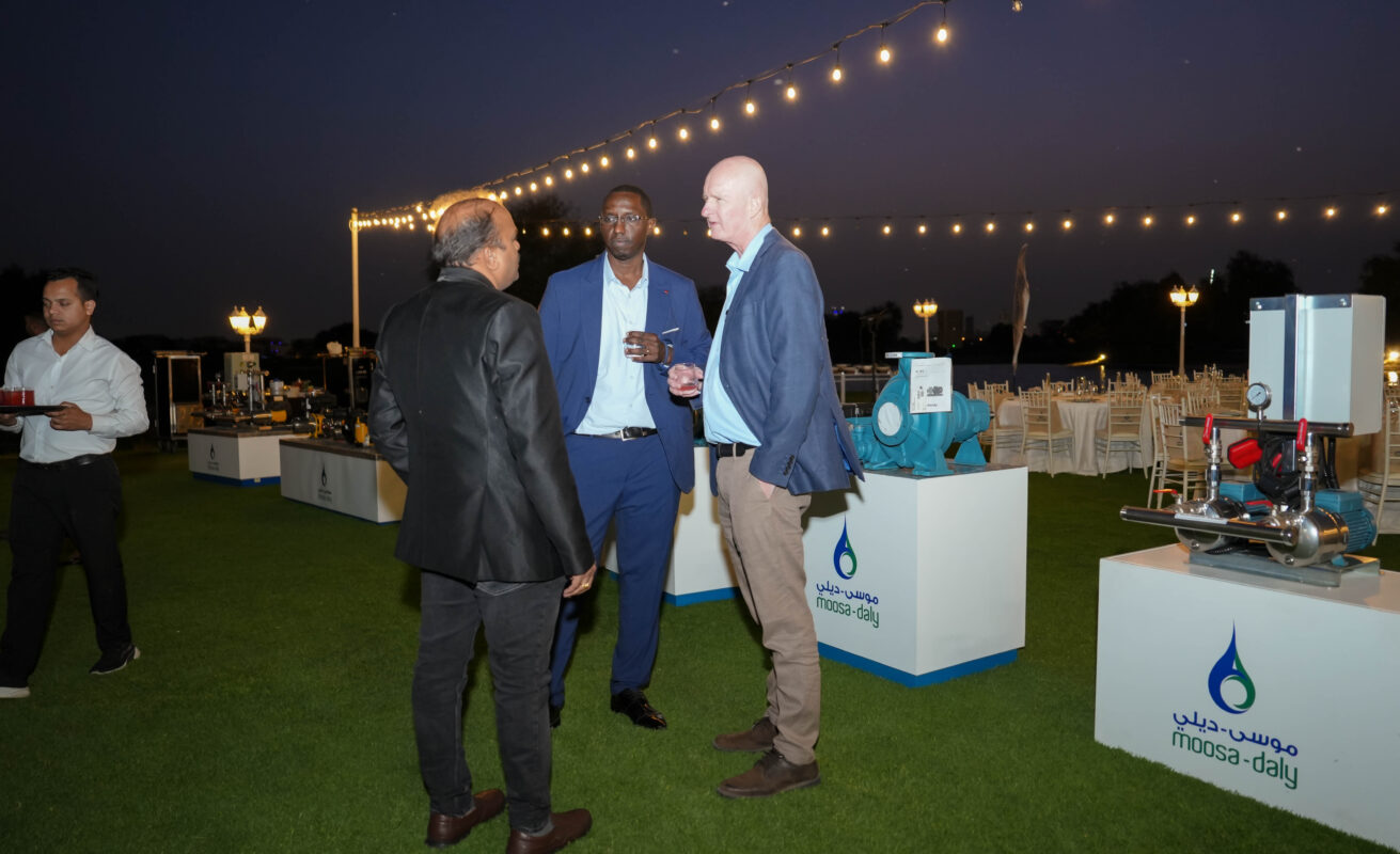 Guests networking beside product displays at the Moosa-Daly 2025 Product Show in Dubai.