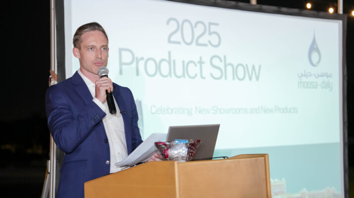 Man presenting at the 2025 Moosa-Daly Product Show, celebrating new showrooms and product launches.